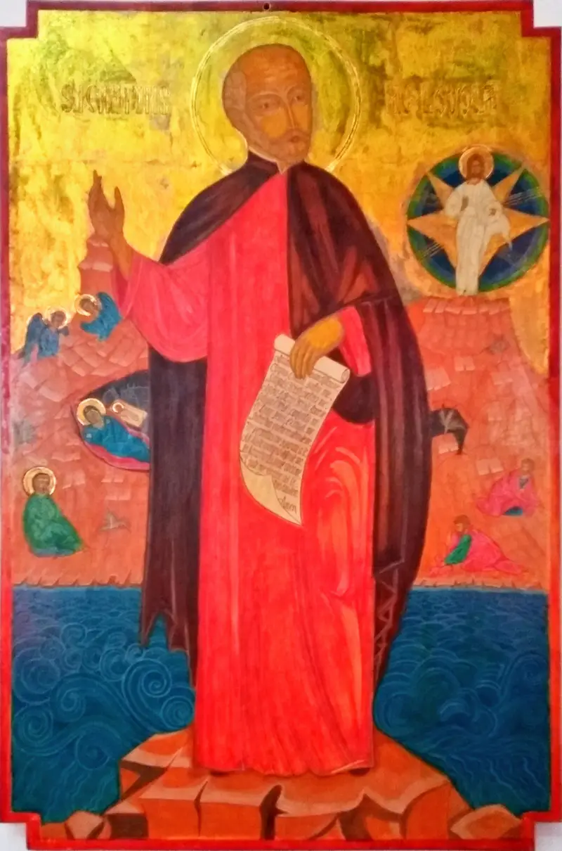 L’icona di sant’Ignazio di Loyola: il santo in veste rossa, in piedi su una roccia sopra il mare, con un rotolo in mano e Cristo nella gloria in alto, su fondo oro